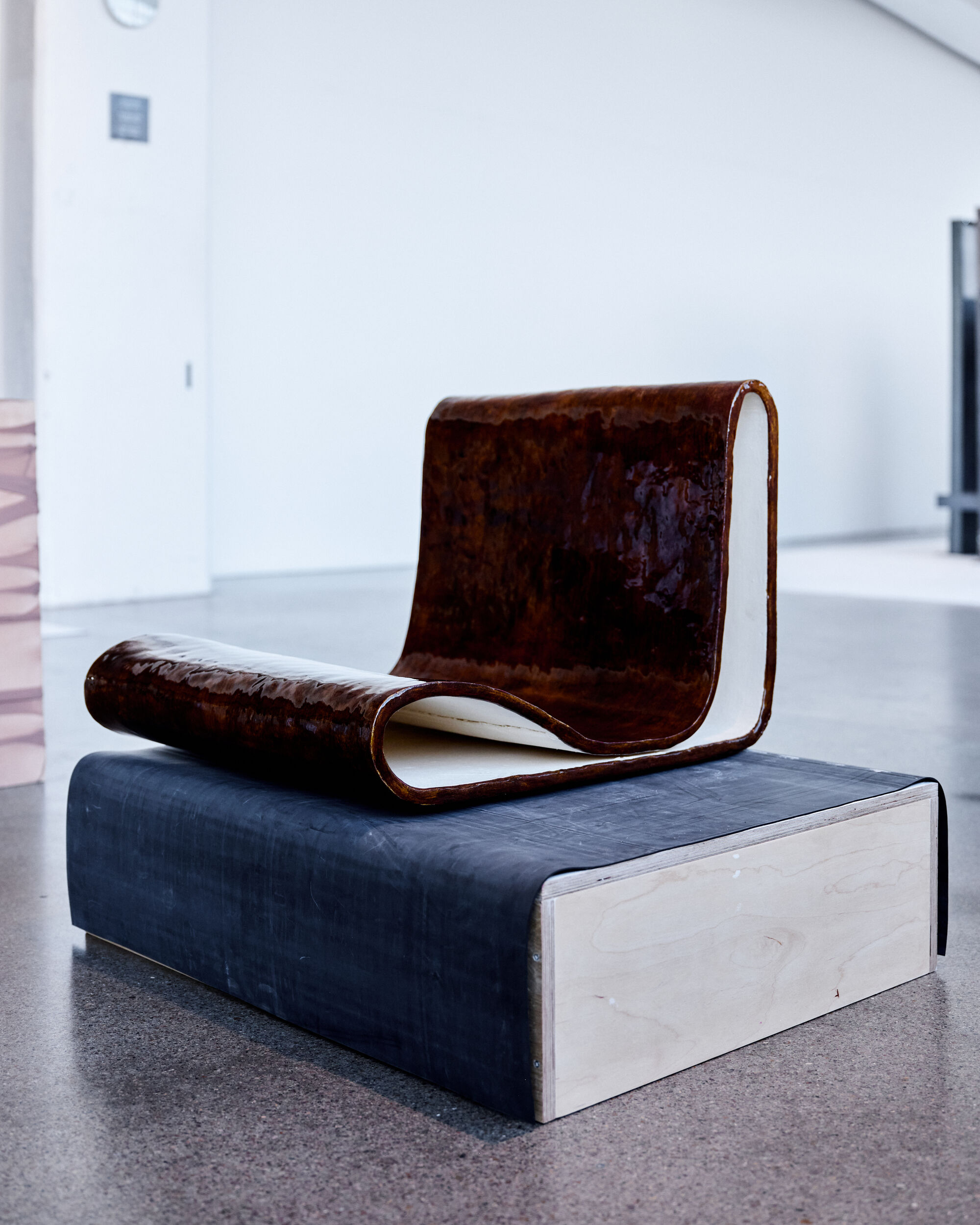 Emma clarke curved leather lounge chair