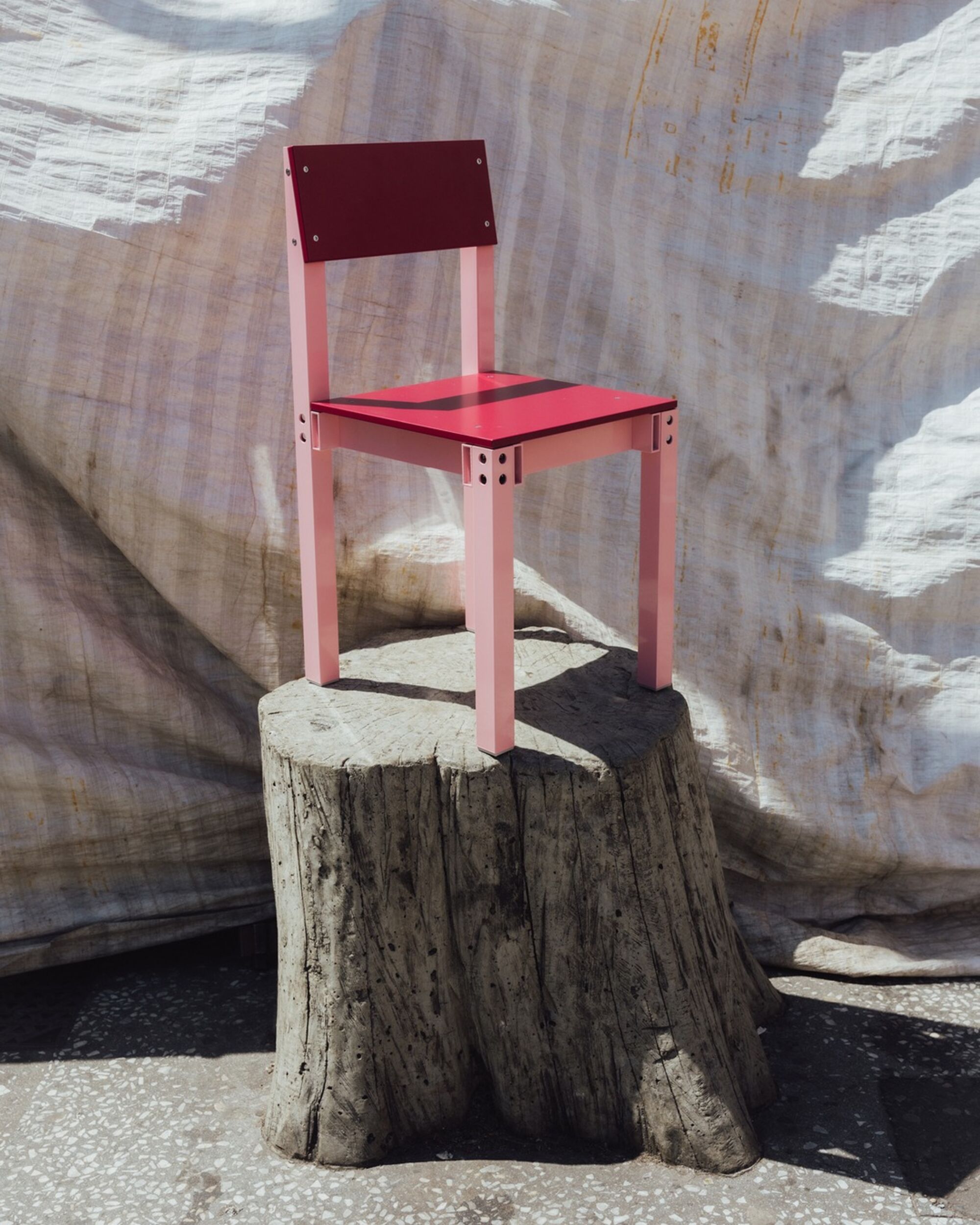 Joy objects pink chair tree stump