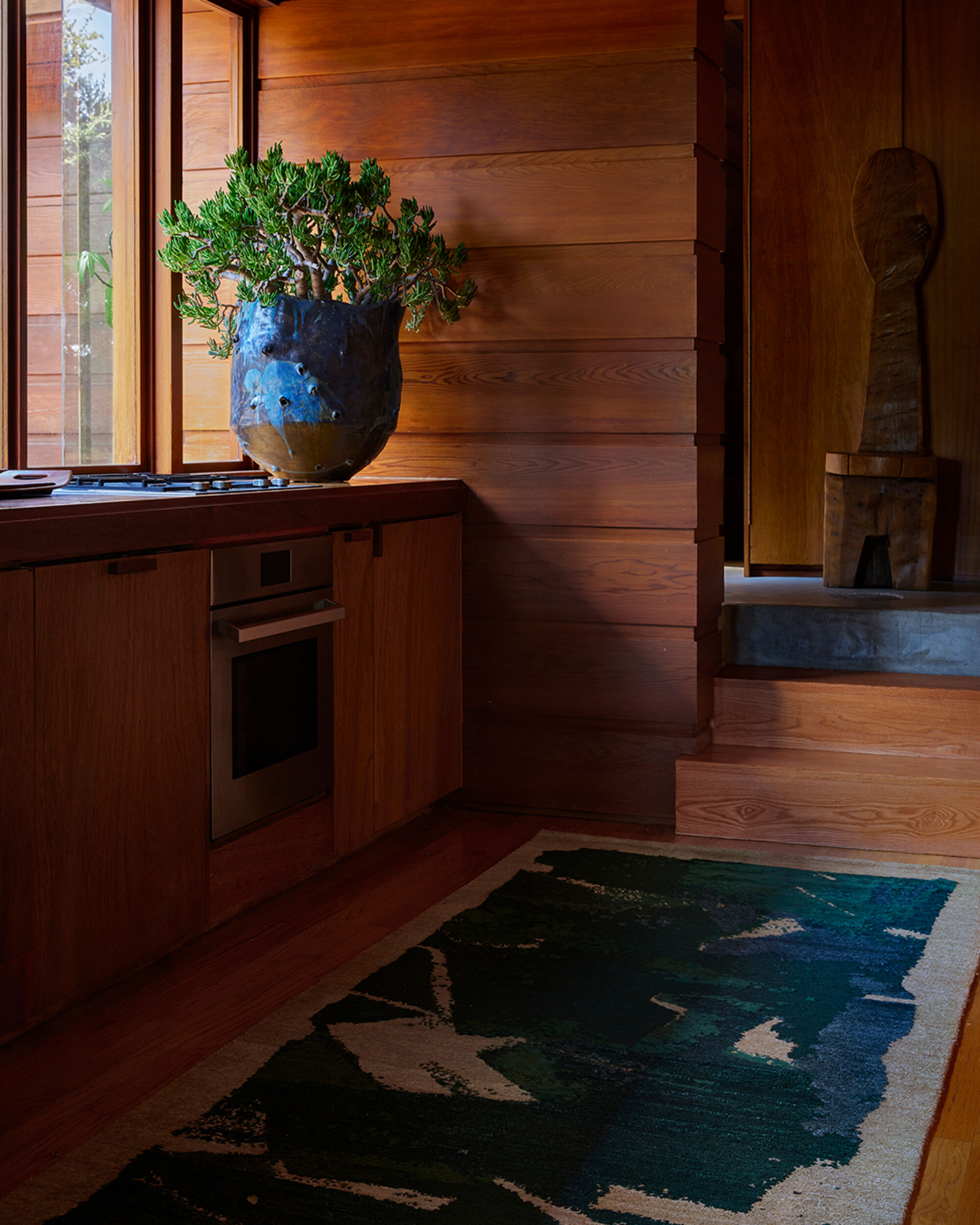 Marc philip teal rug wood kitchen interior