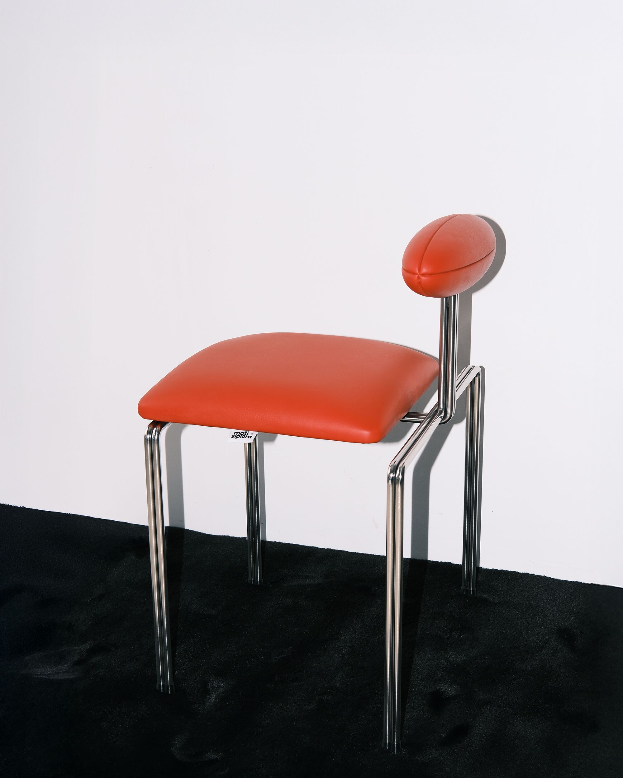Mati sipiora red leather chrome chair side view